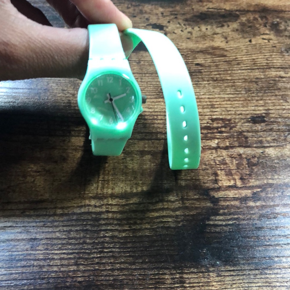Teal wrap watch with white numbers